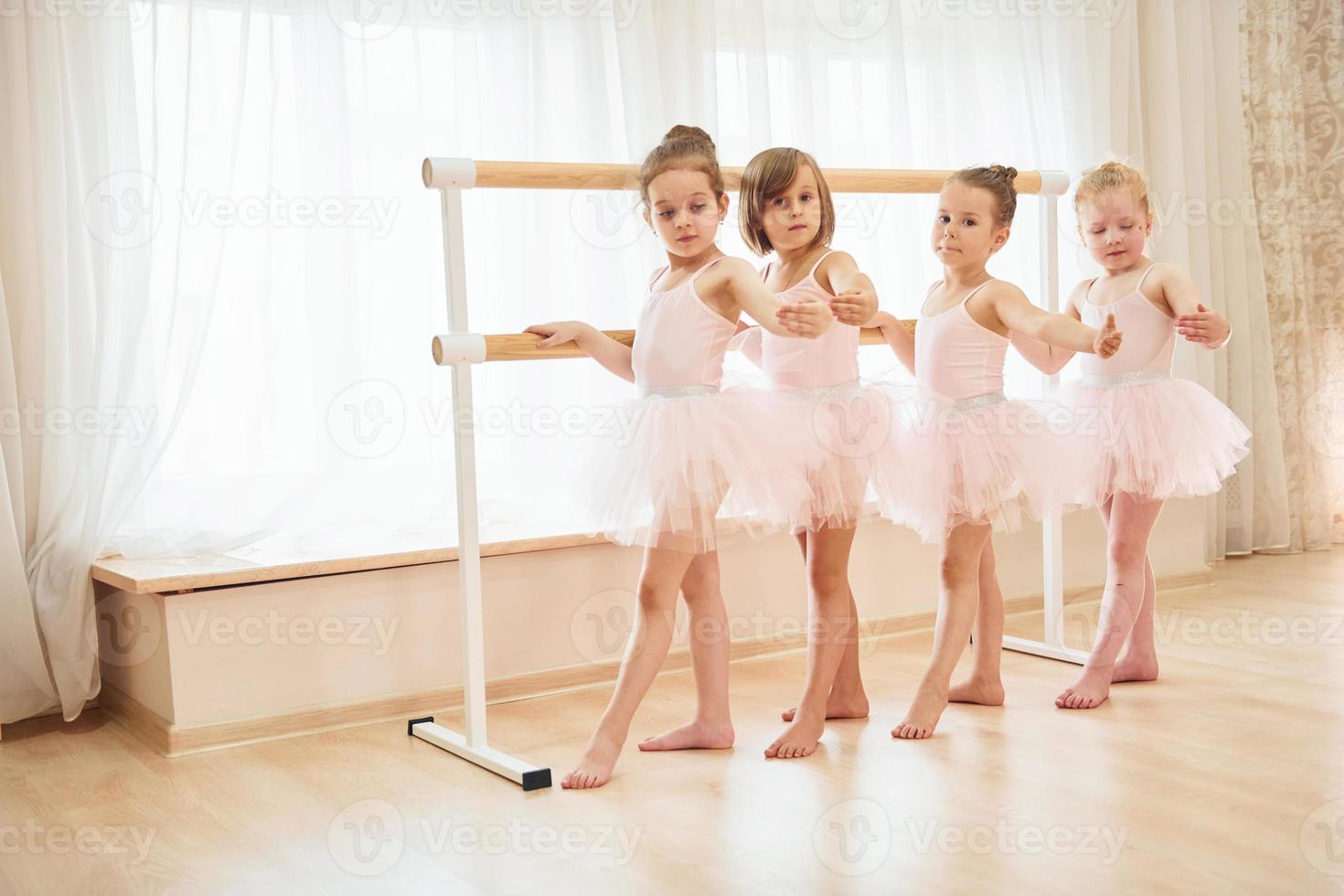 Conception of art. Little ballerinas preparing for performance photo