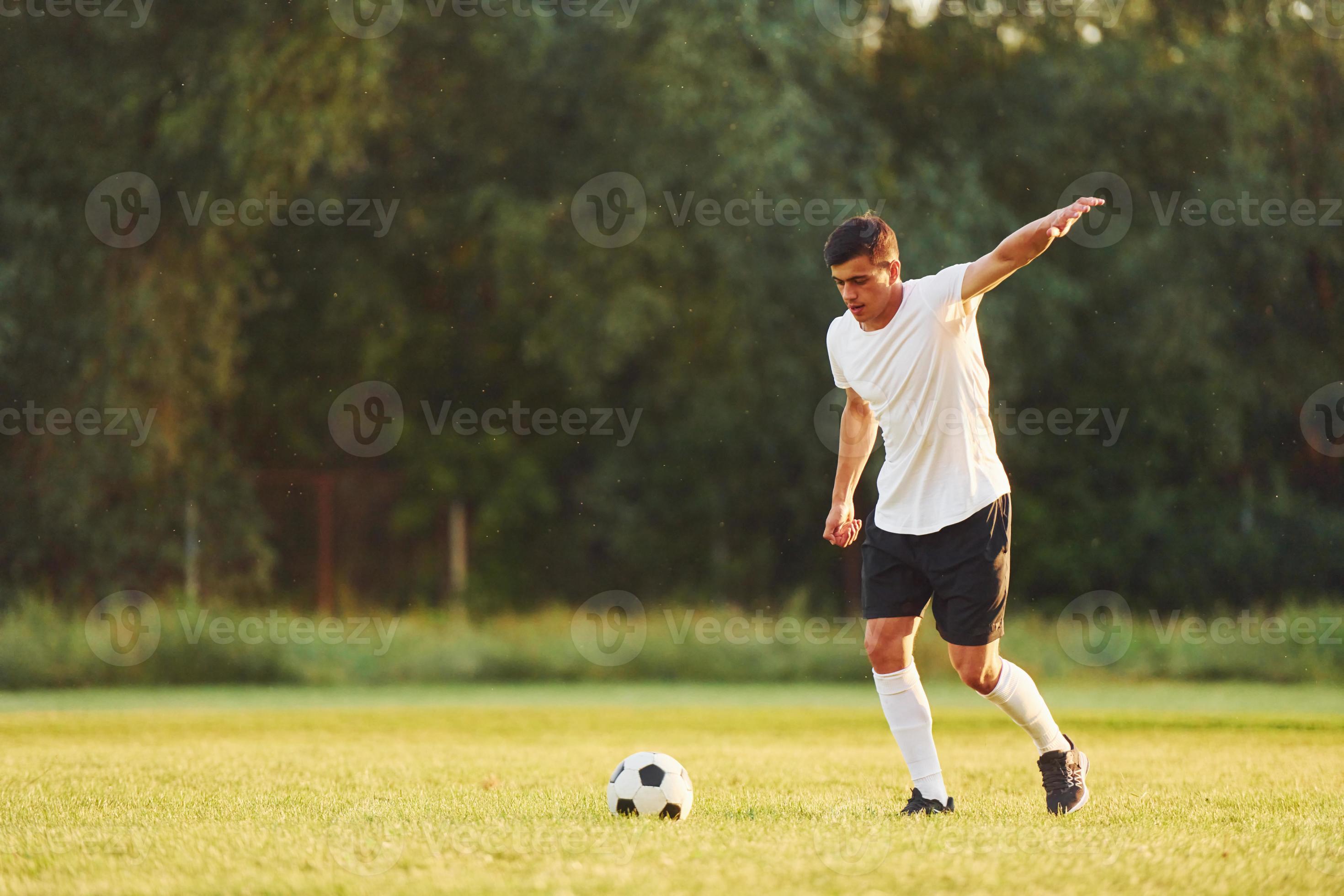 Professional practice. Young soccer player have training on the