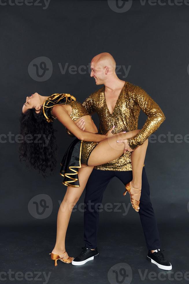 Professional dancers. Cheerful couple is together indoors photo