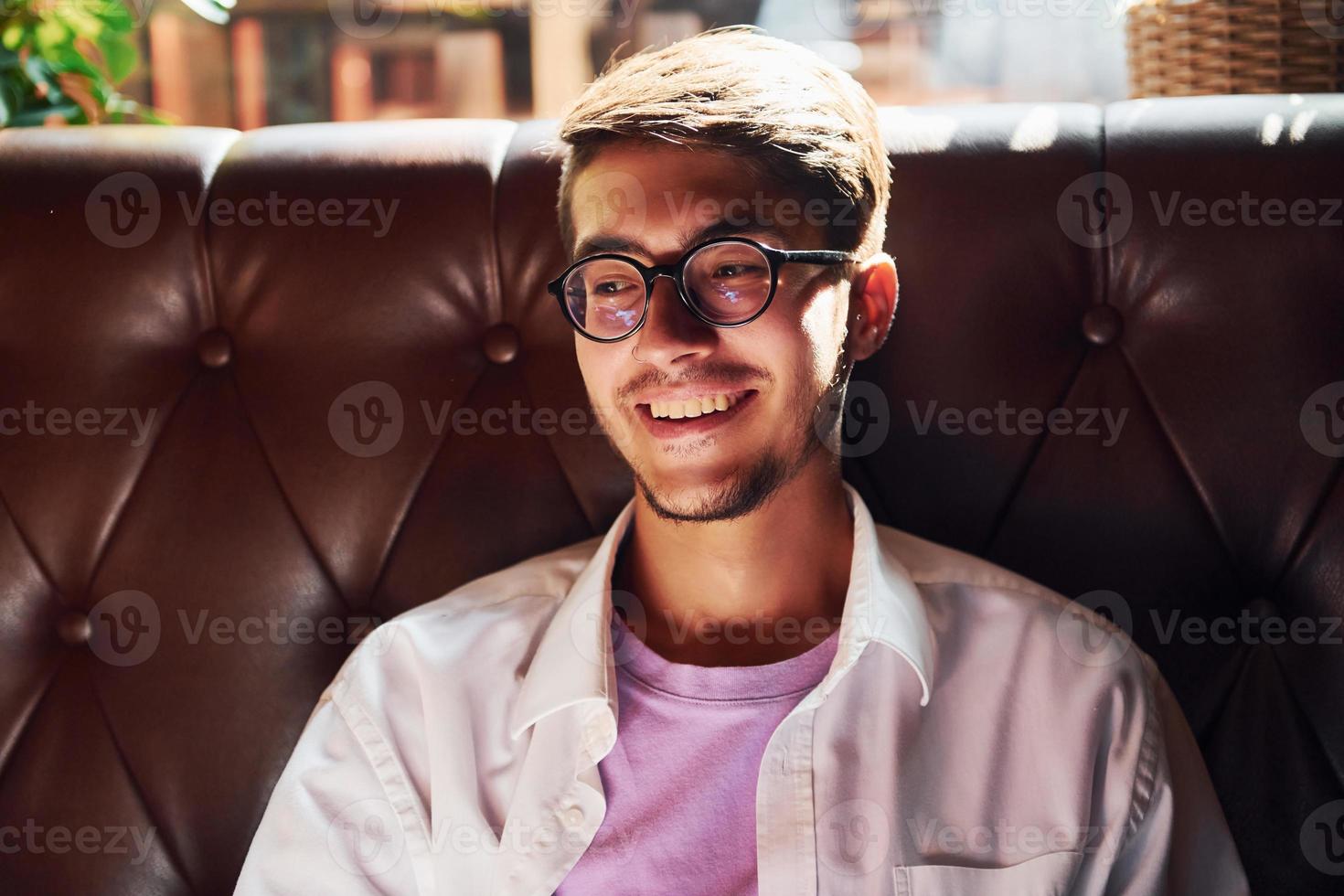 Weekend relax. Man in casual clothes sitting in the pub photo
