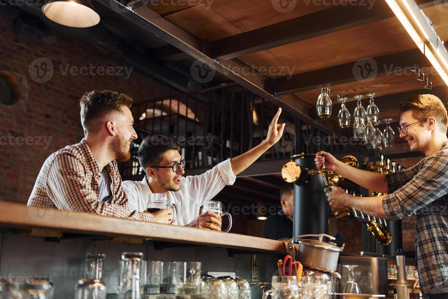Facial expression. People in casual clothes sitting in the pub photo