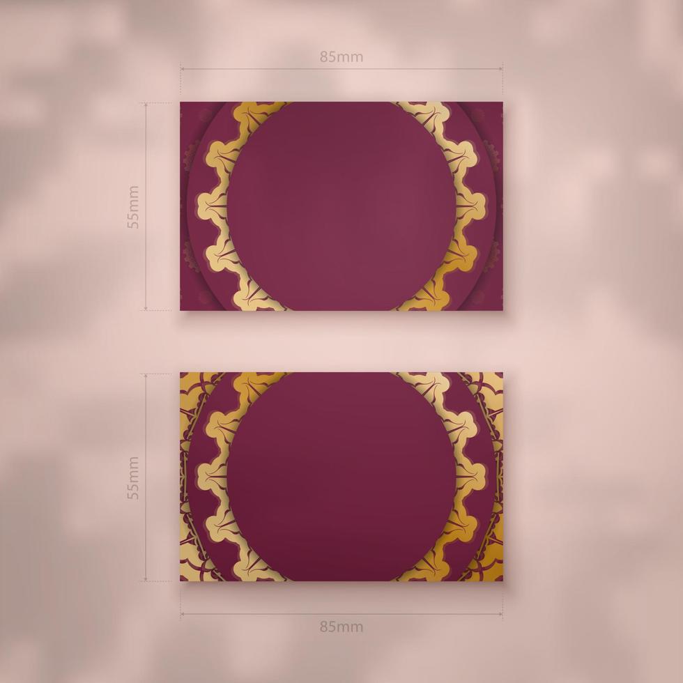 Burgundy business card with Indian gold ornaments for your brand. vector