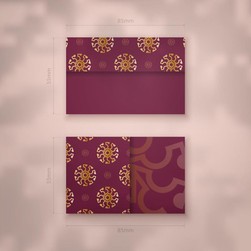 Burgundy business card with Greek gold pattern for your business. vector