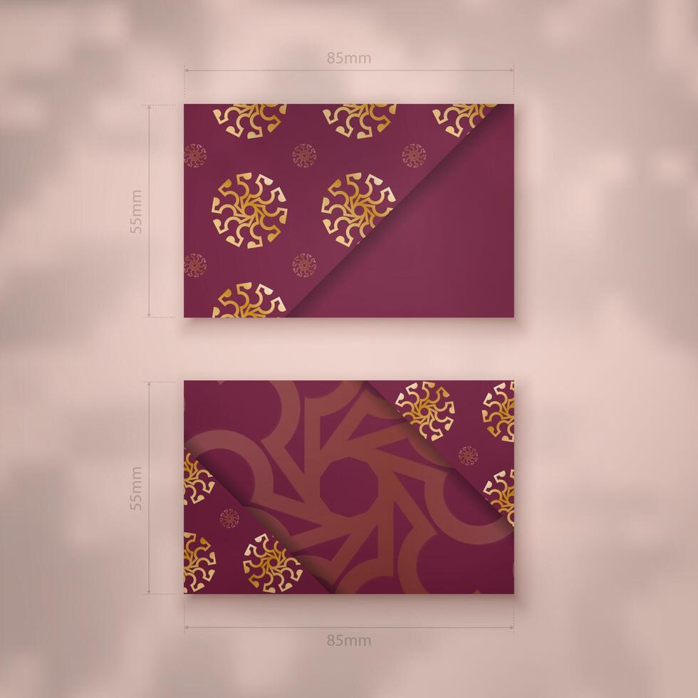 Burgundy business card with Greek gold pattern for your contacts. vector