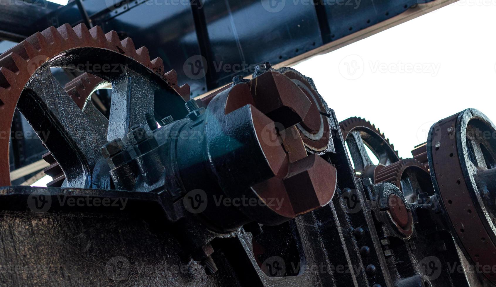 Rusty worn machinery cog gears photo