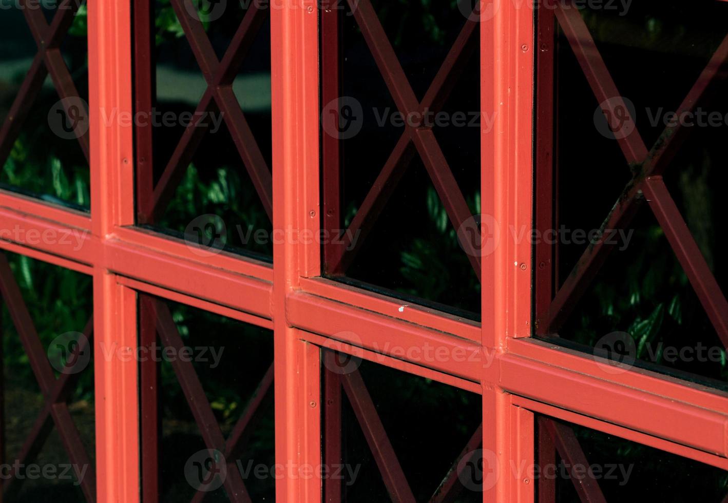 Abstract building window glass with red panes photo