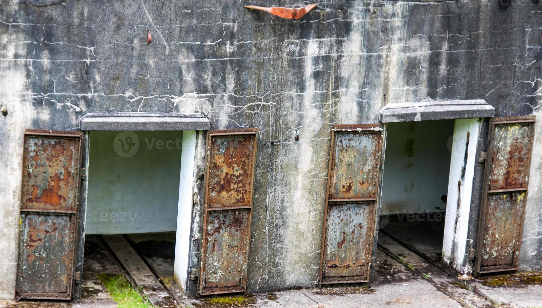 Rusty Iron doors on a concrete wall photo