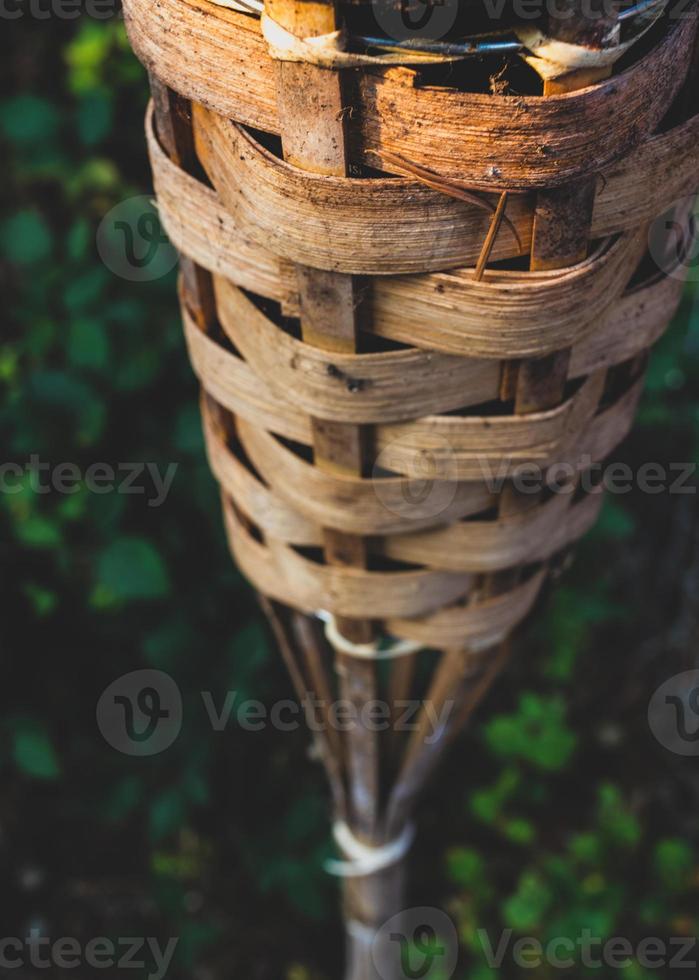 Abstract close up bamboo tiki torch photo