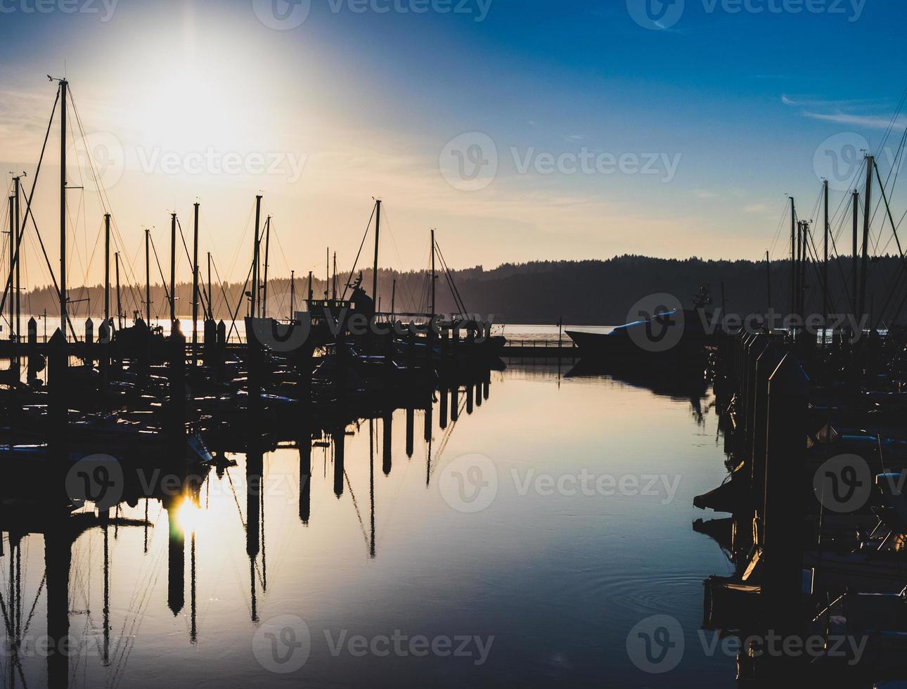 Morning sunrise harbor with hazy filtered light and shadows photo