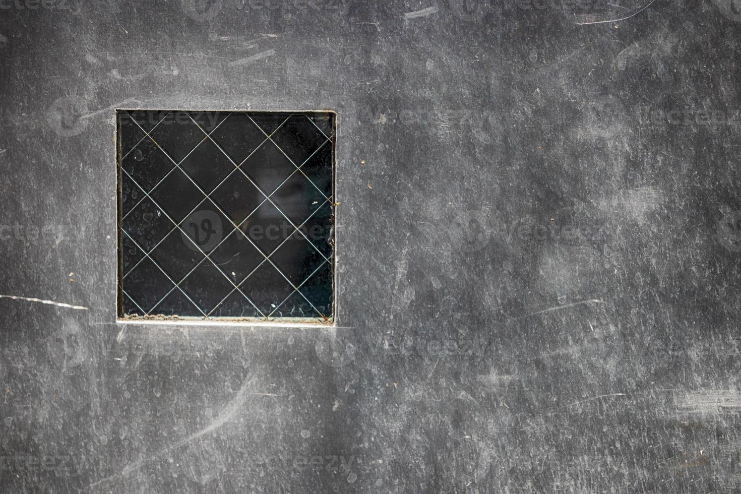 Abstract steel plate with small window photo