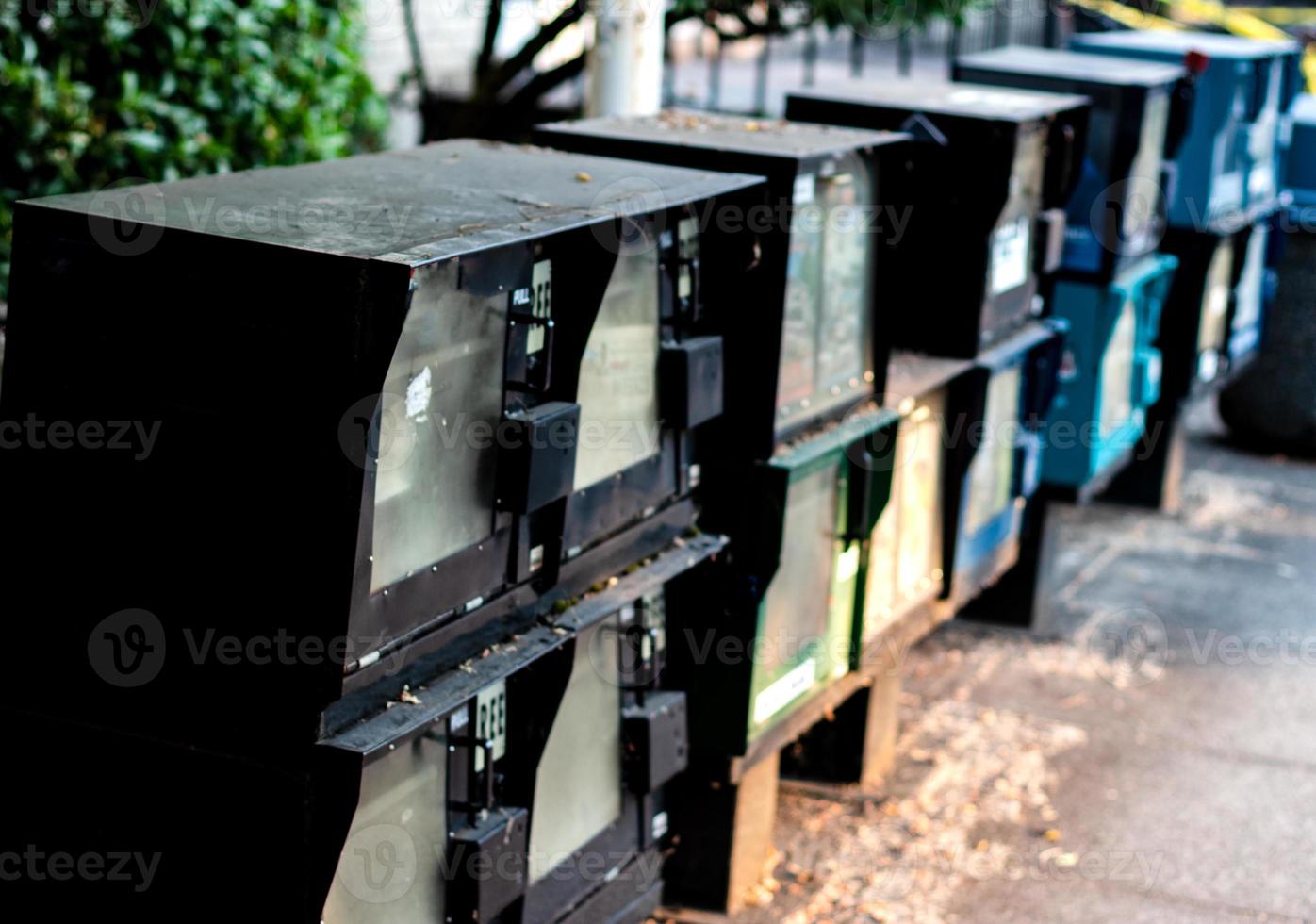 Newspaper dispenser vending machines in a row photo