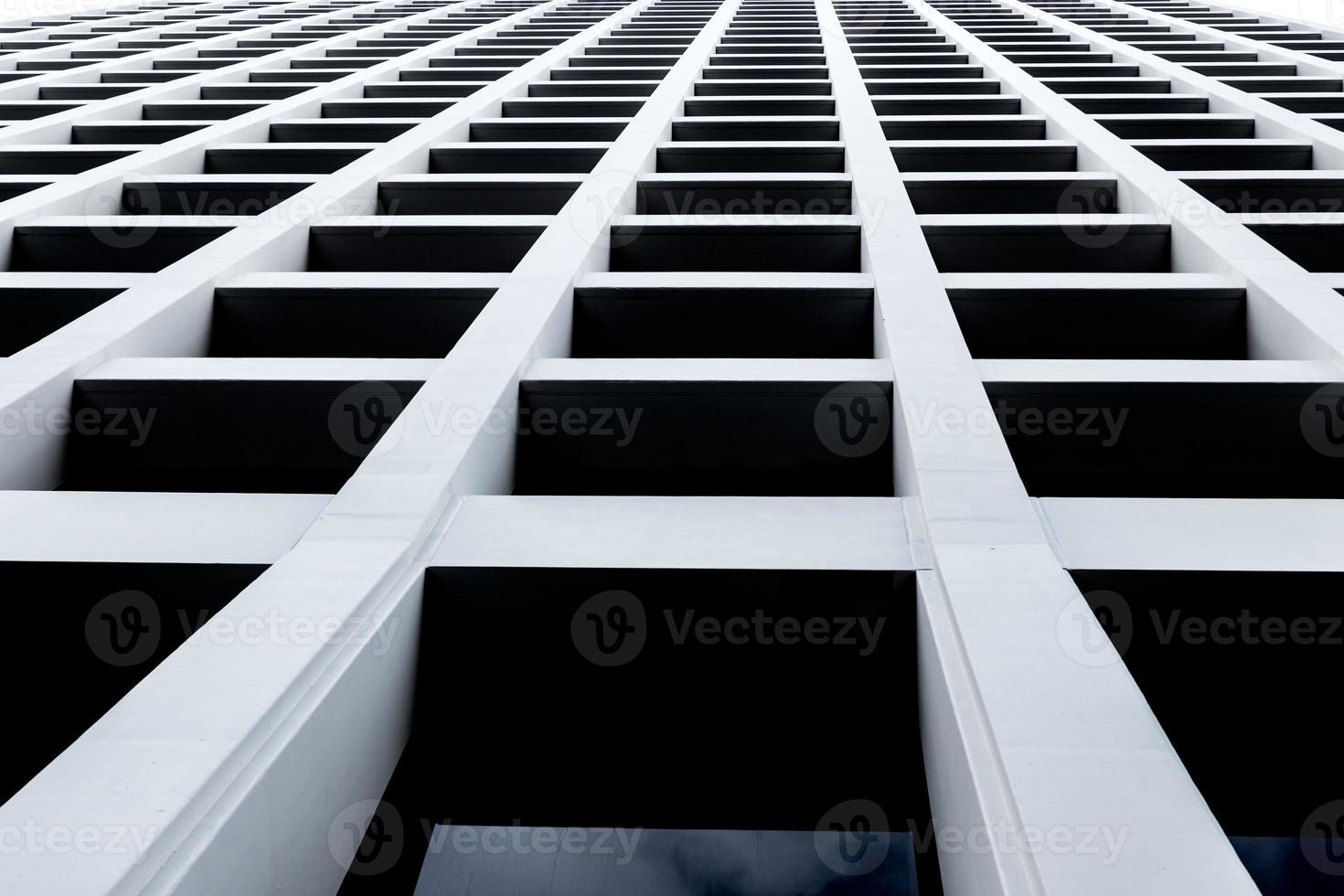 Abstract skyscraper looking up from street level photo