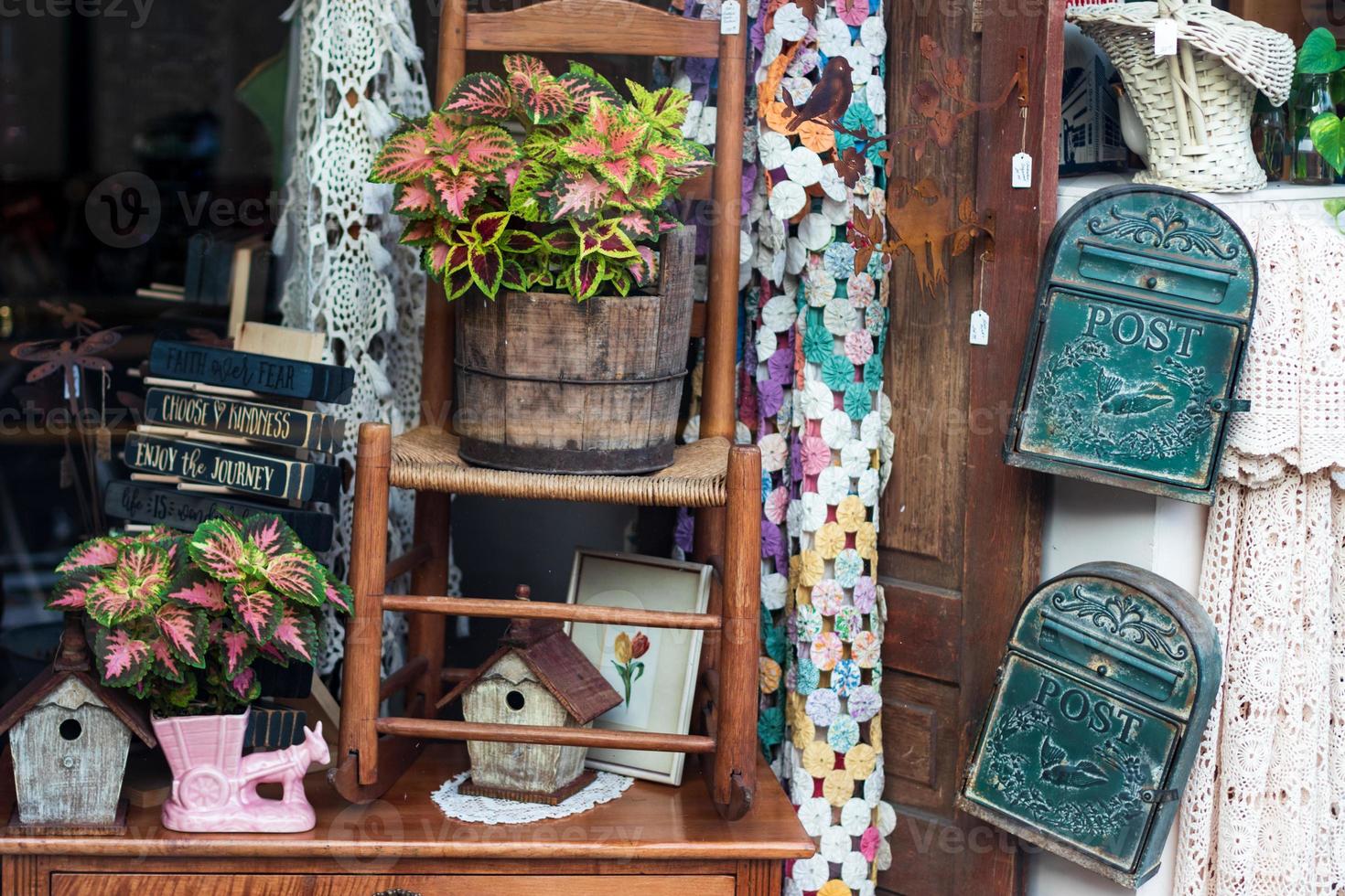 Antique shop window with various odds and ends photo