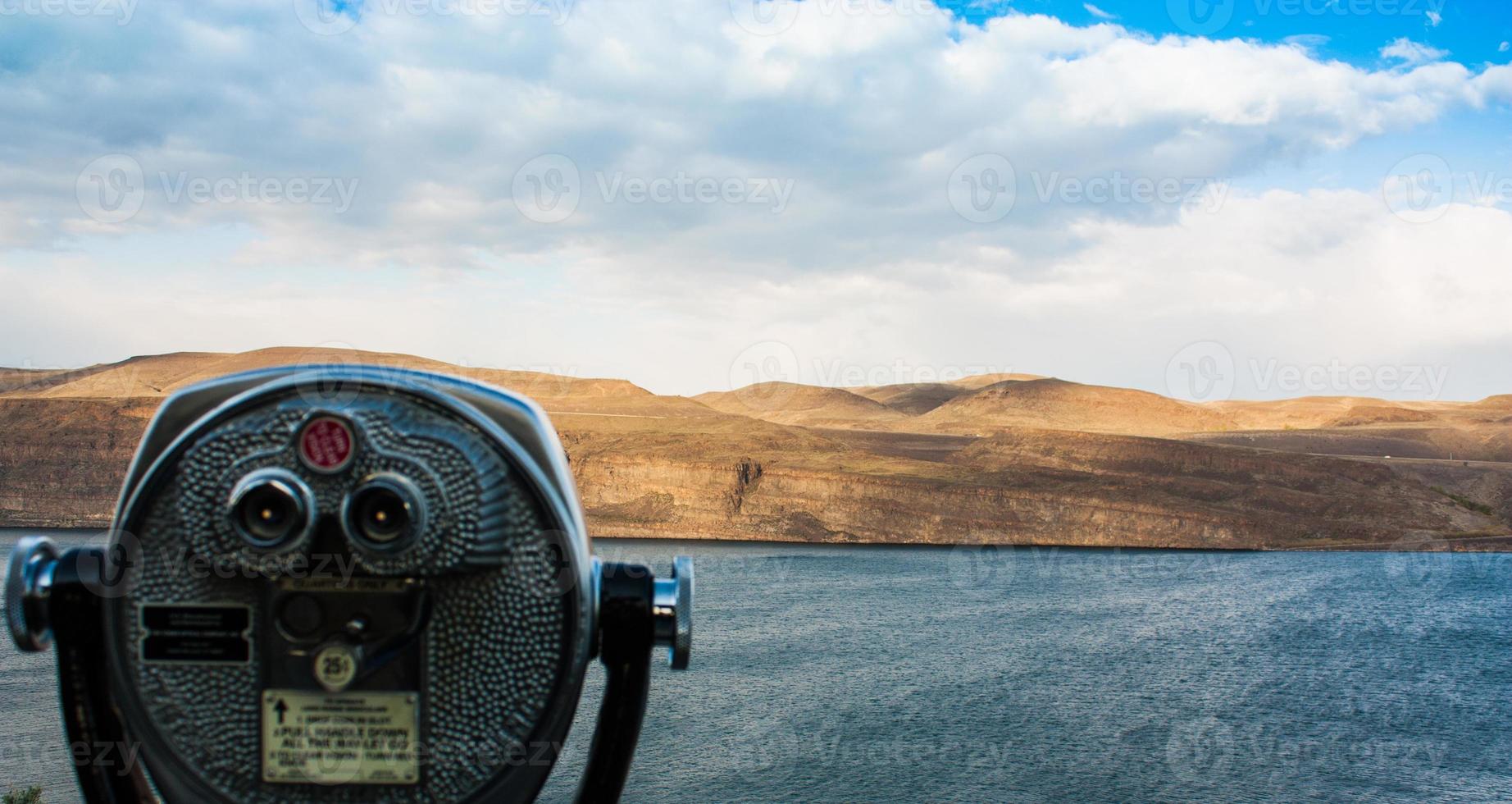 Scenic desert river view showing coin-op binoculars photo