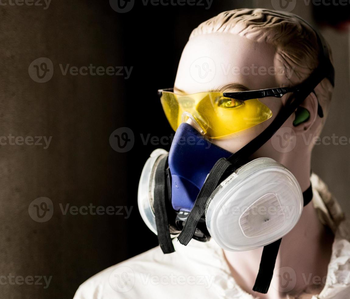 Safety mannequin modeling glasses and respirator mask photo