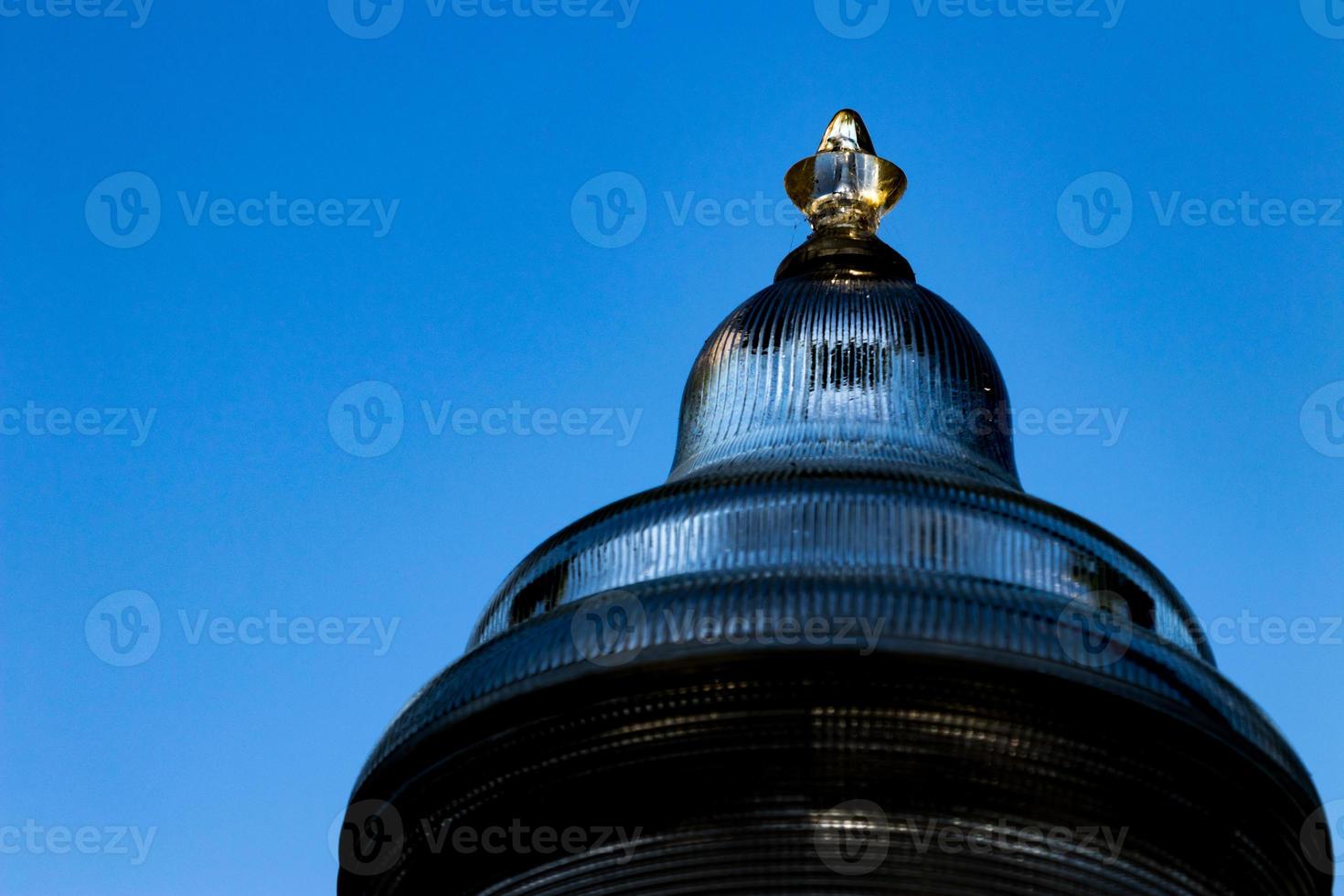 Glass street lamp head close up photo