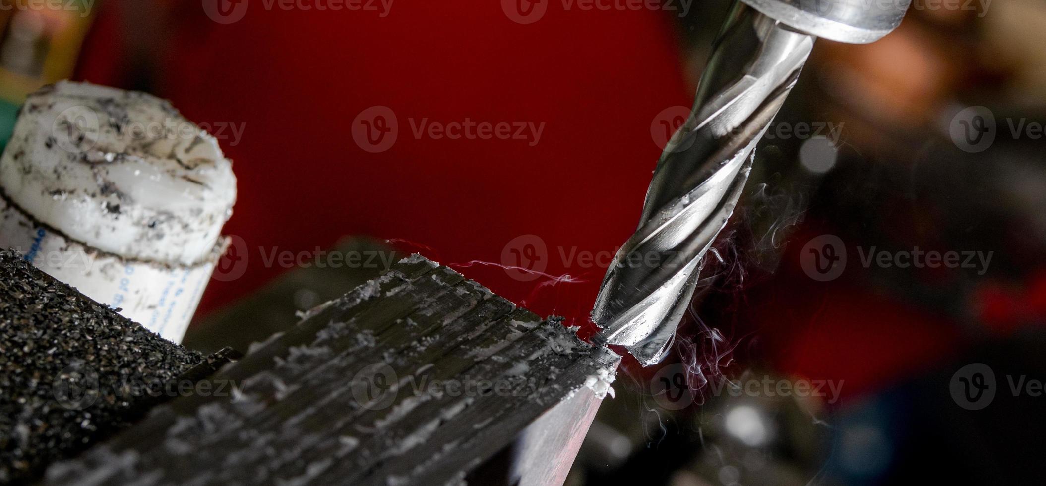 Bridgeport CNC end mill finishing a stack of steel photo