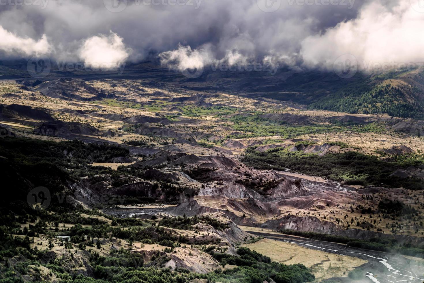 Mt. St. Helens area foggy cloudy forest valley with river photo