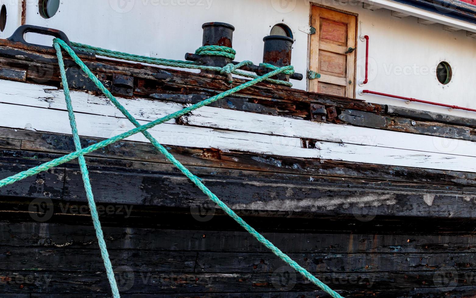 Mooring rope attached to a boat with a door photo