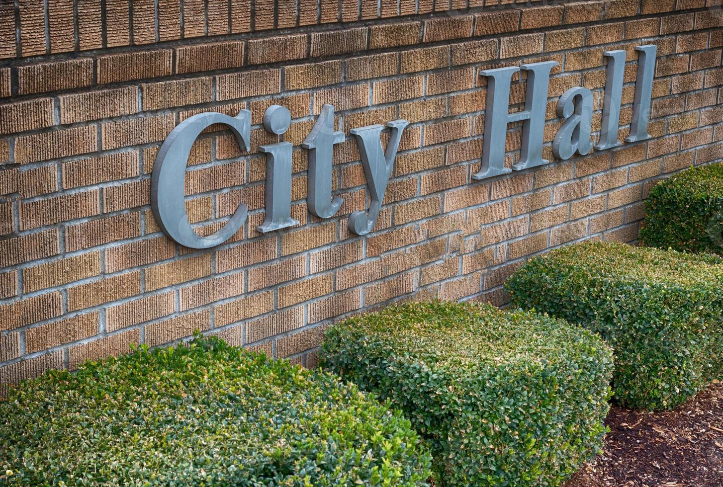City Hall sign on a brick wall photo
