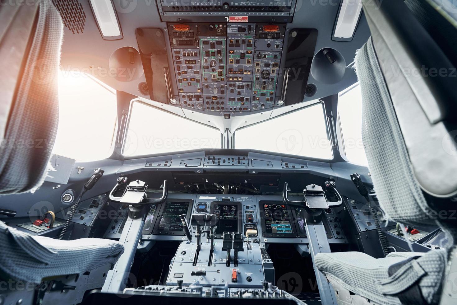 Beautiful sunlight. Close up focused view of airplane cockpit photo