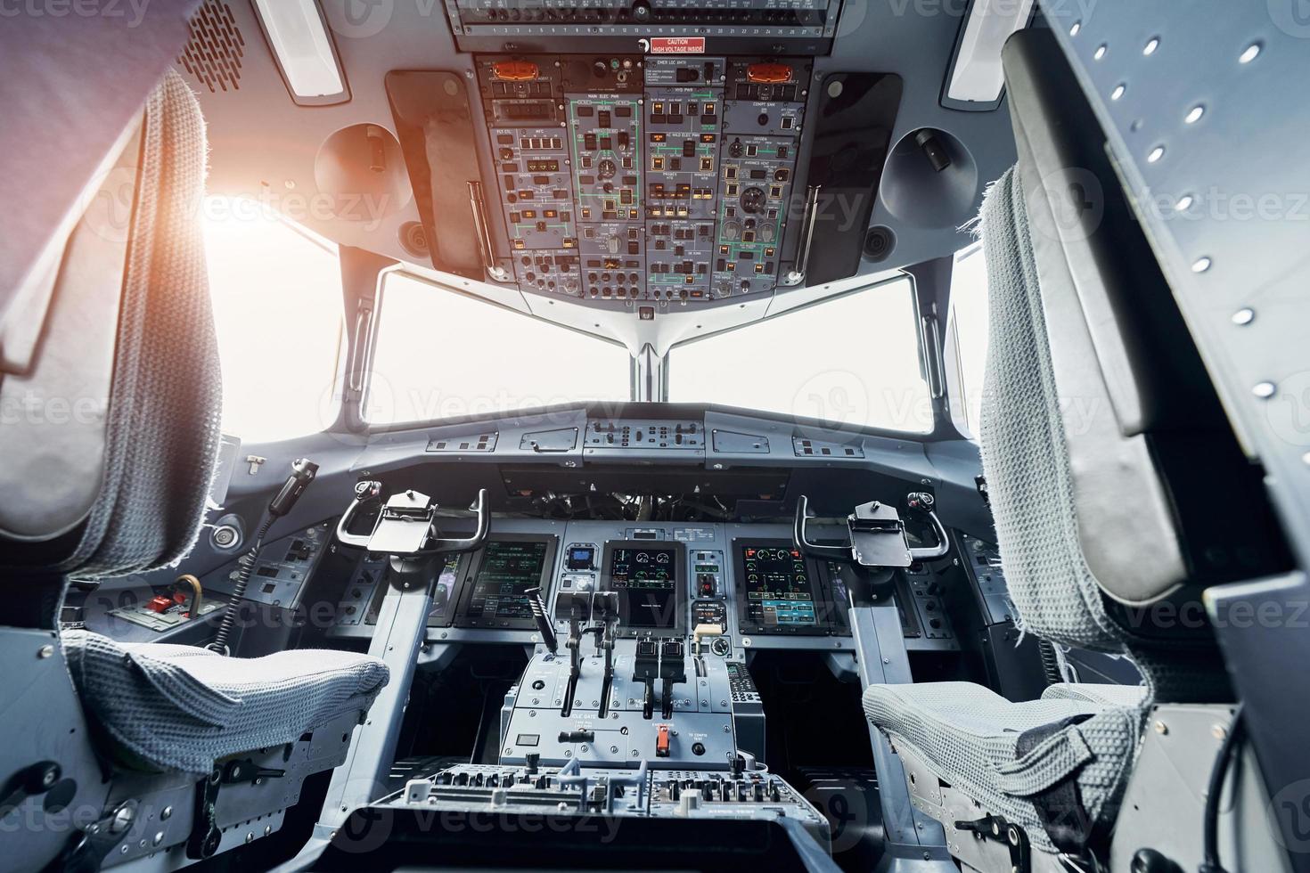 Beautiful sunlight. Close up focused view of airplane cockpit photo