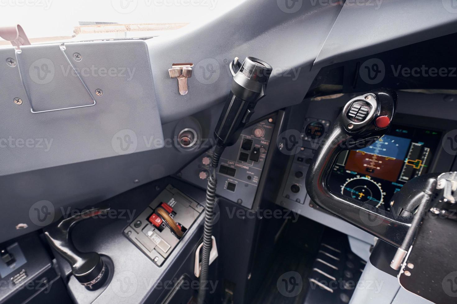 Different displays. Close up focused view of airplane cockpit photo