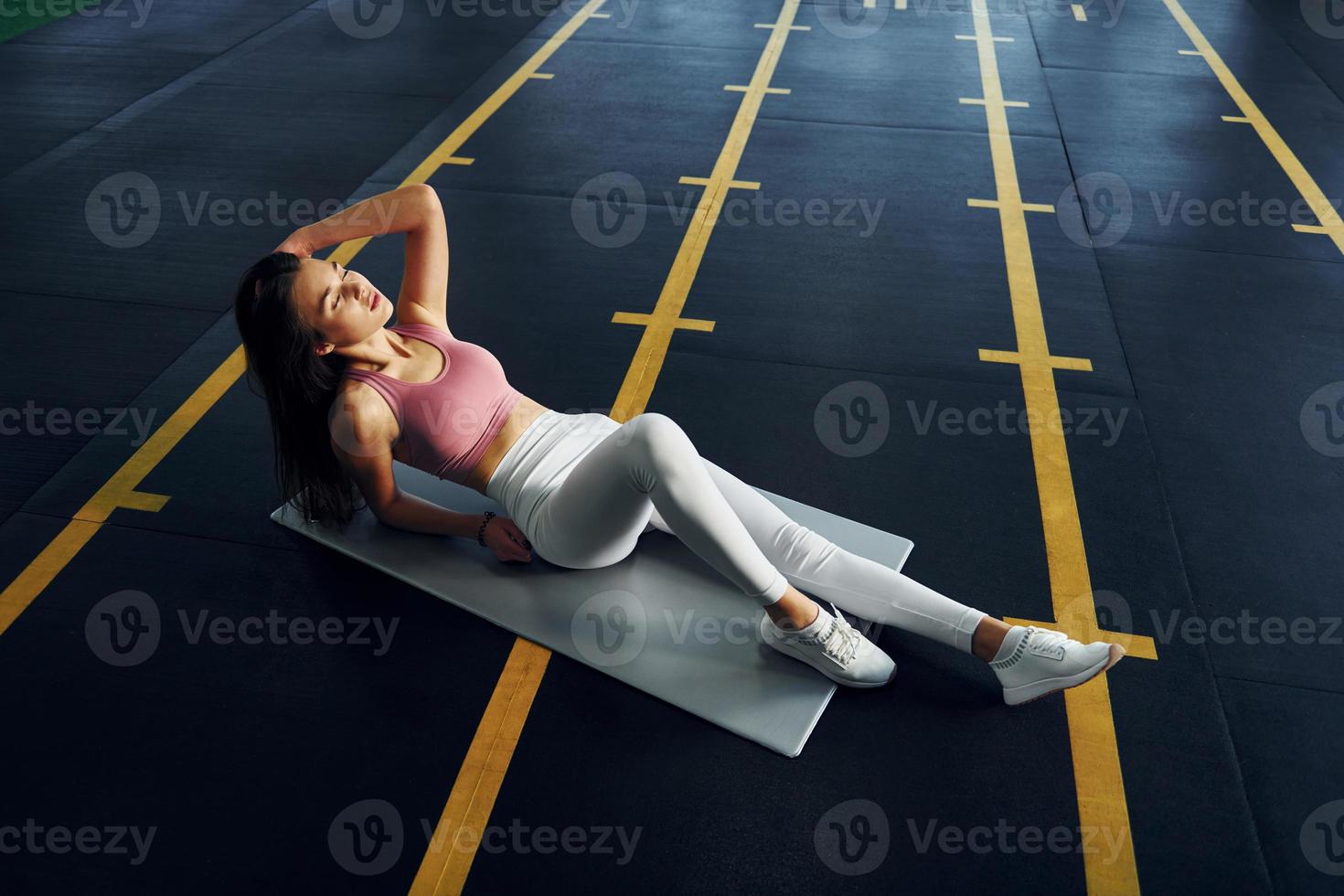 Conception of body care. Beautiful young woman with slim body type is in  the gym 15461799 Stock Photo at Vecteezy