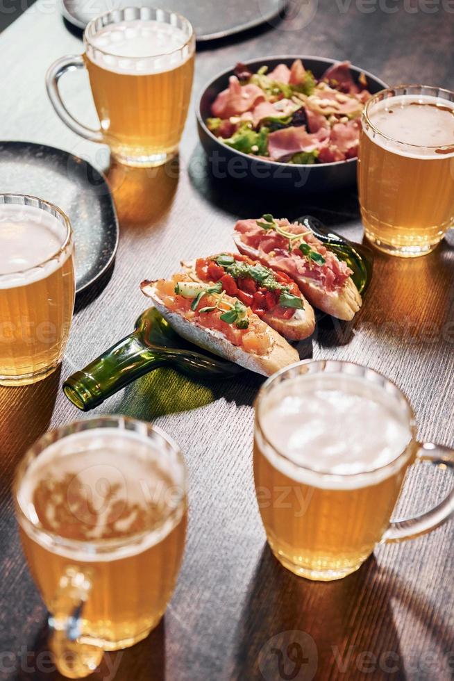 Close up view of food and beer on the table photo