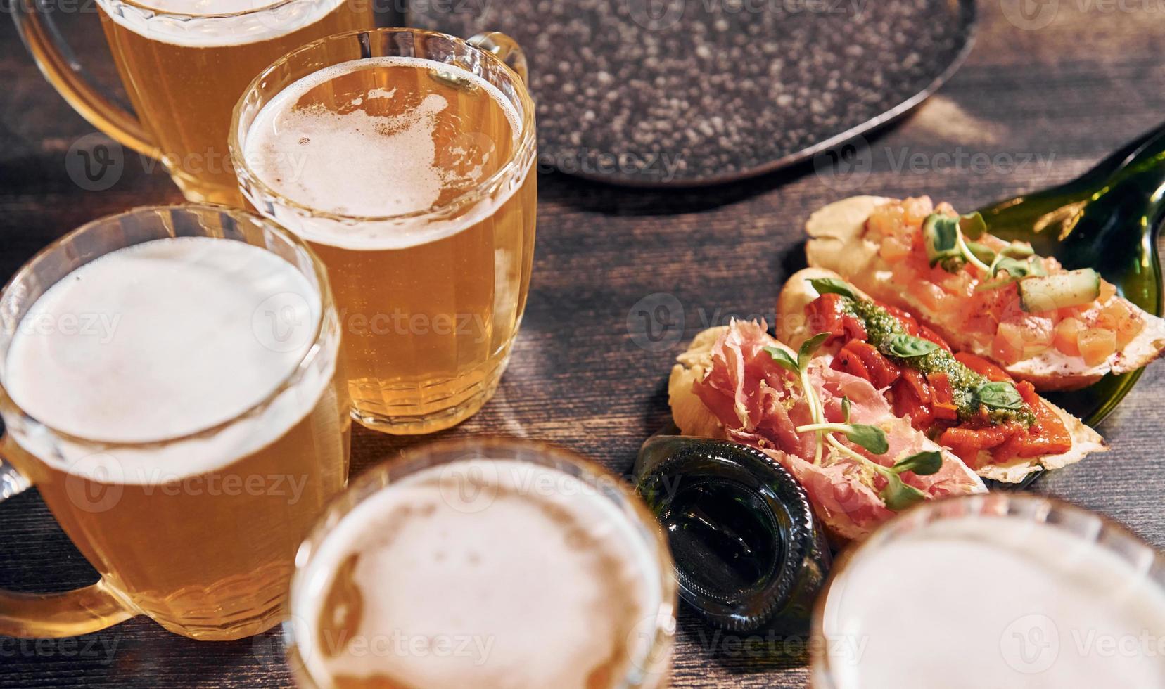 Close up view of food and beer on the table photo