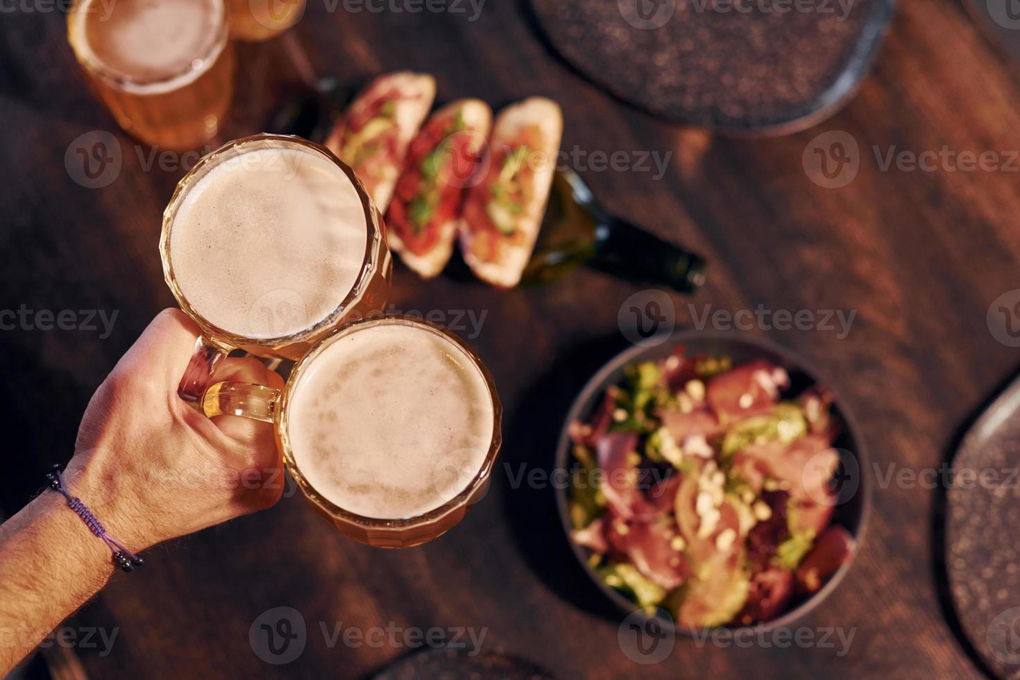 Close up view of food and beer on the table photo