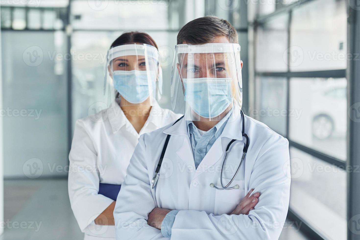 Conception of healthcare. Two doctors in white coats is in the clinic working together photo