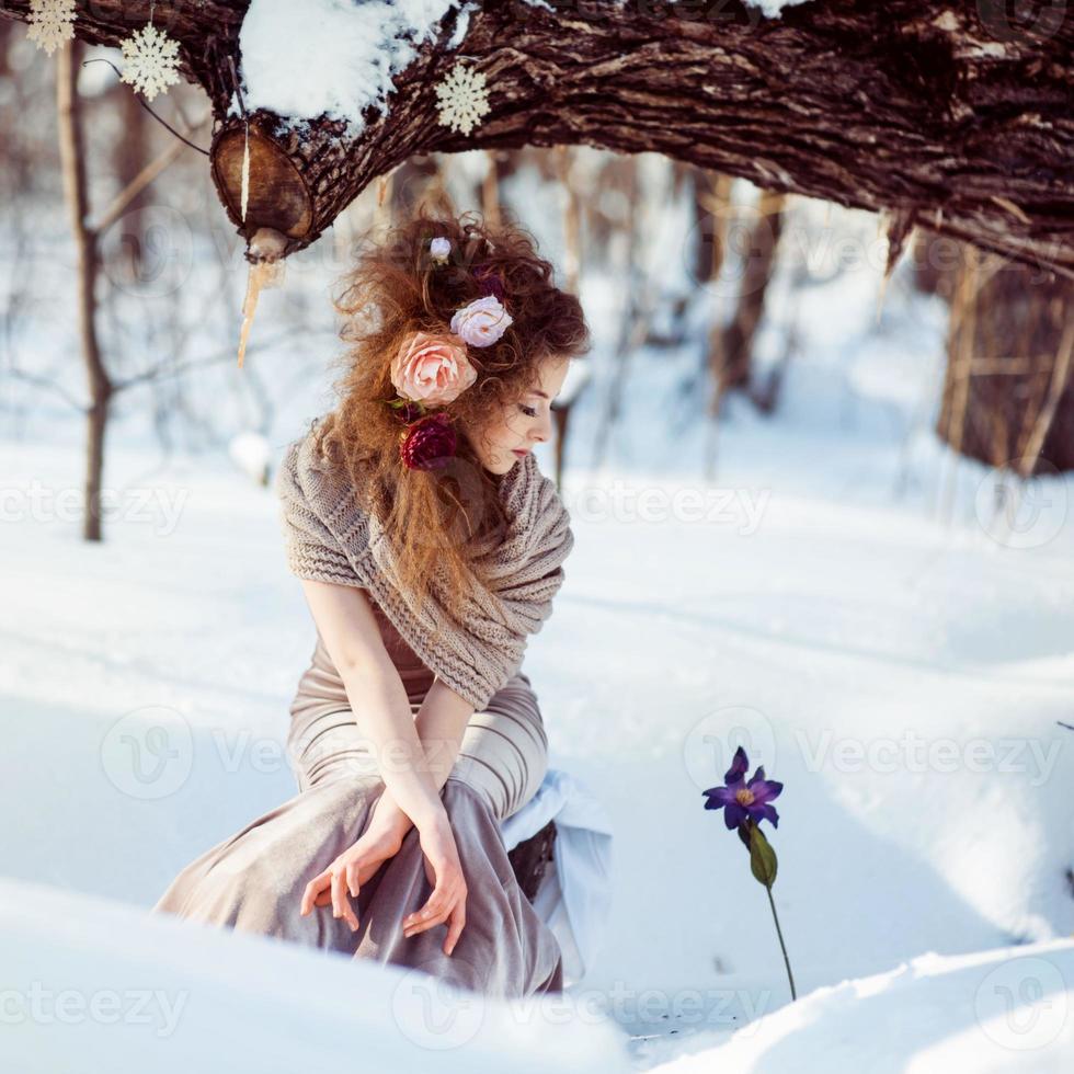 beautiful girl in the winter forest photo