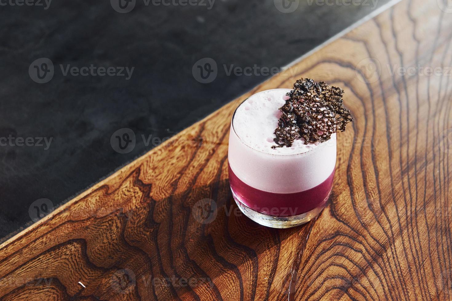 Delicious drink. Close up view of fresh summer cocktail on the wooden table photo