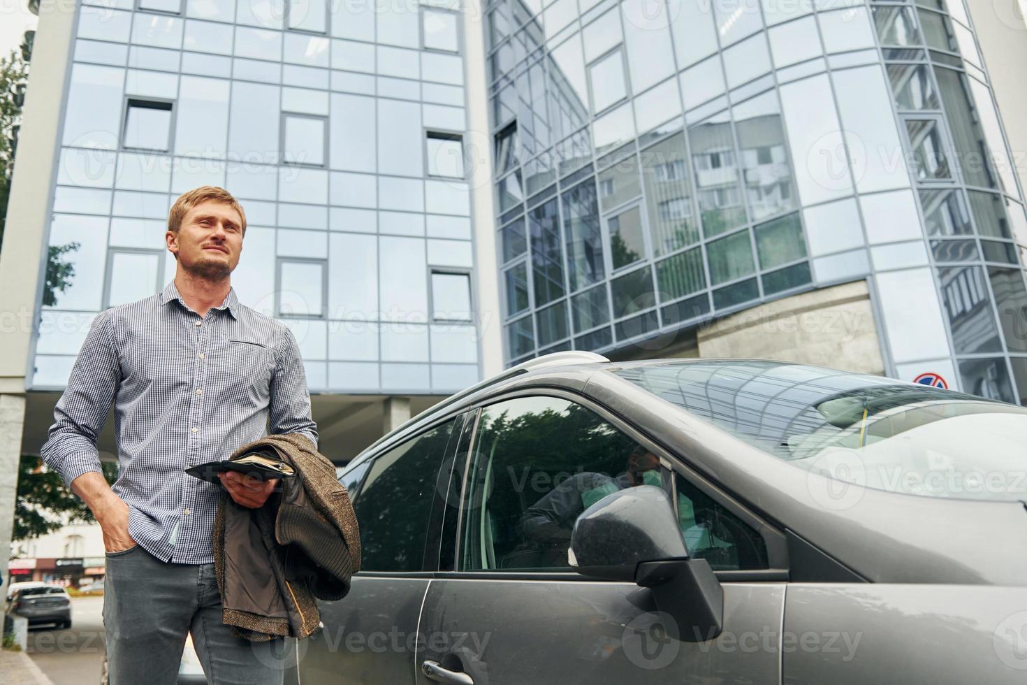 Man having a walk outdoors in the city at daytime photo