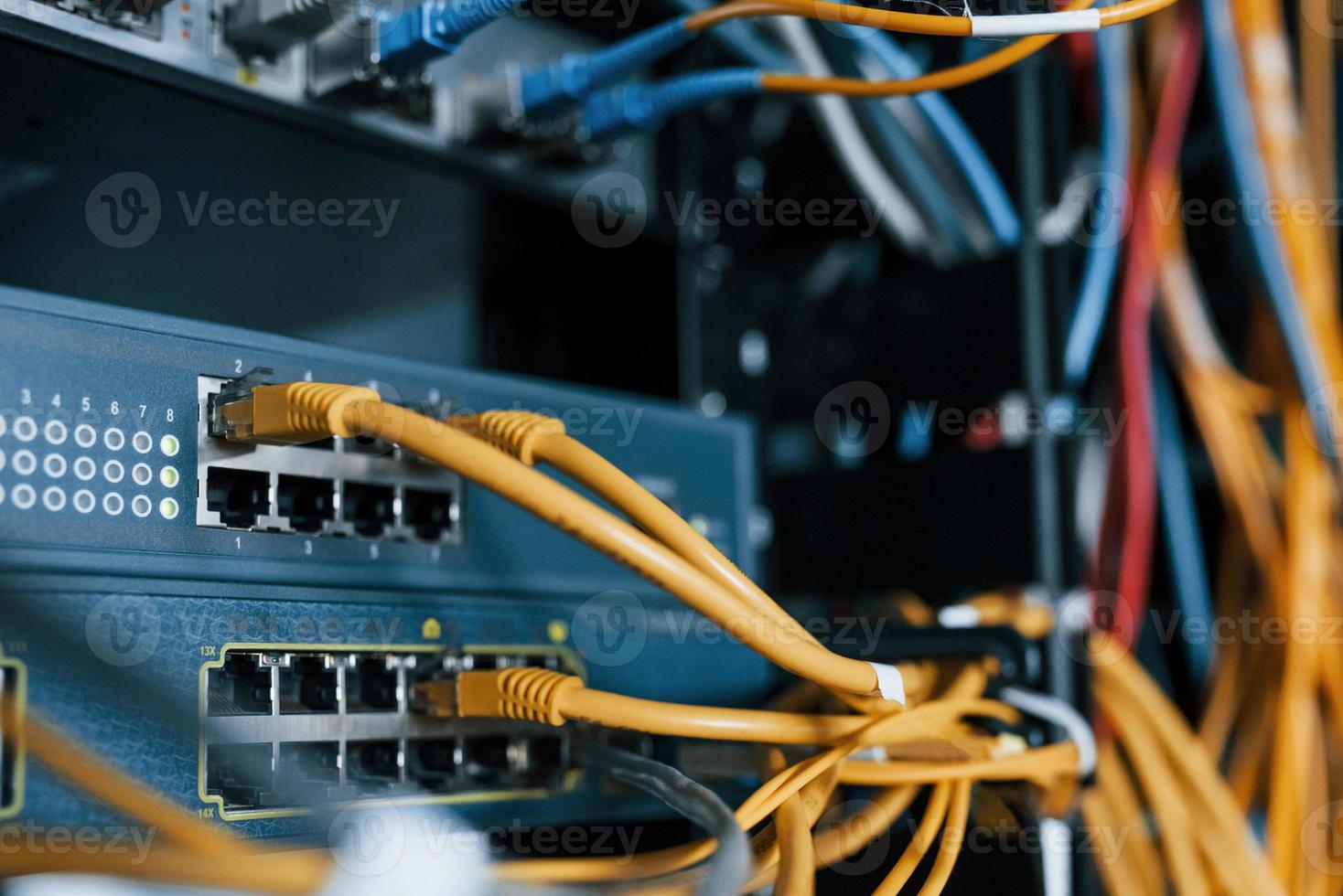 Close up view of internet equipment and cables in the server room photo