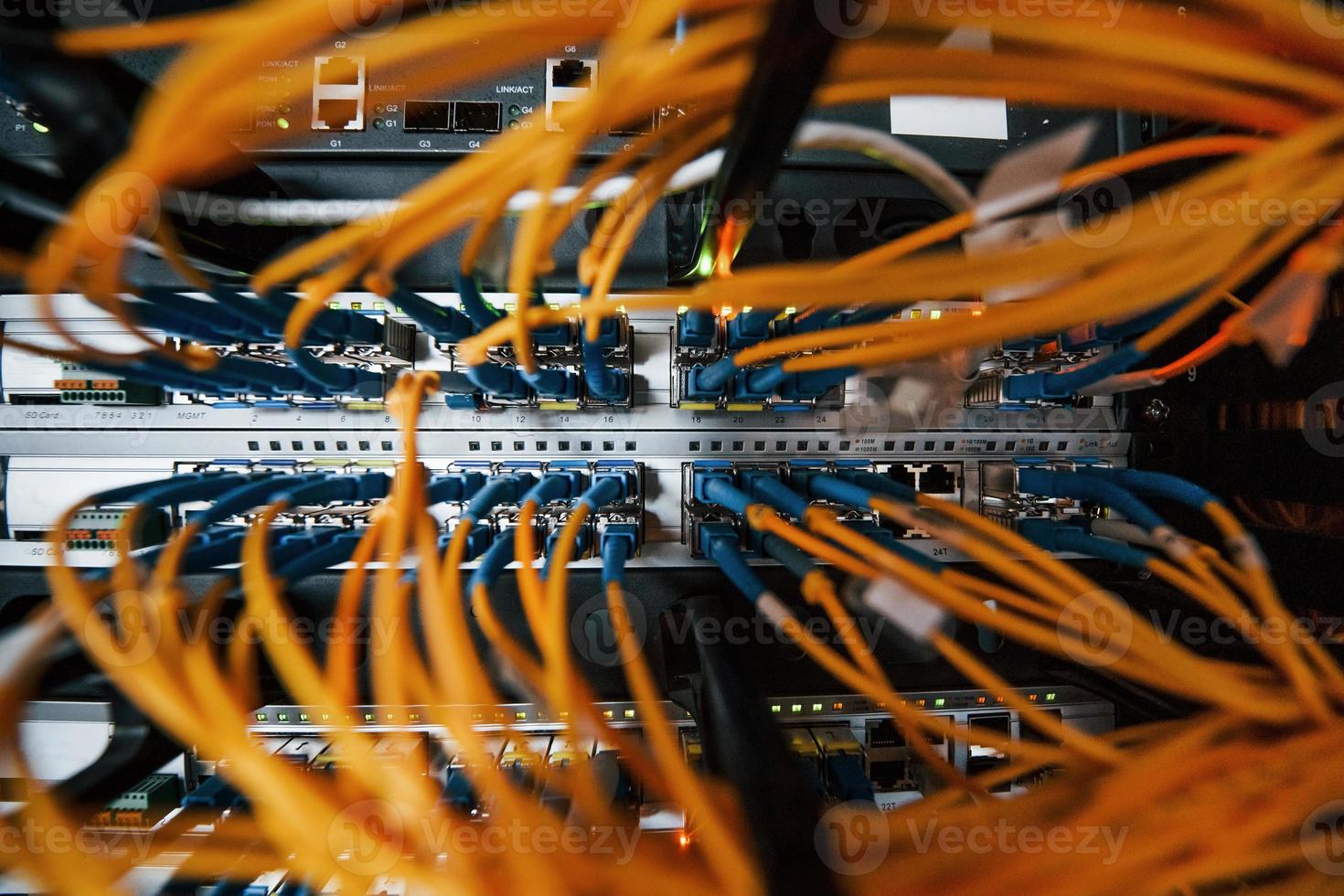 Close up view of internet equipment and cables in the server room photo