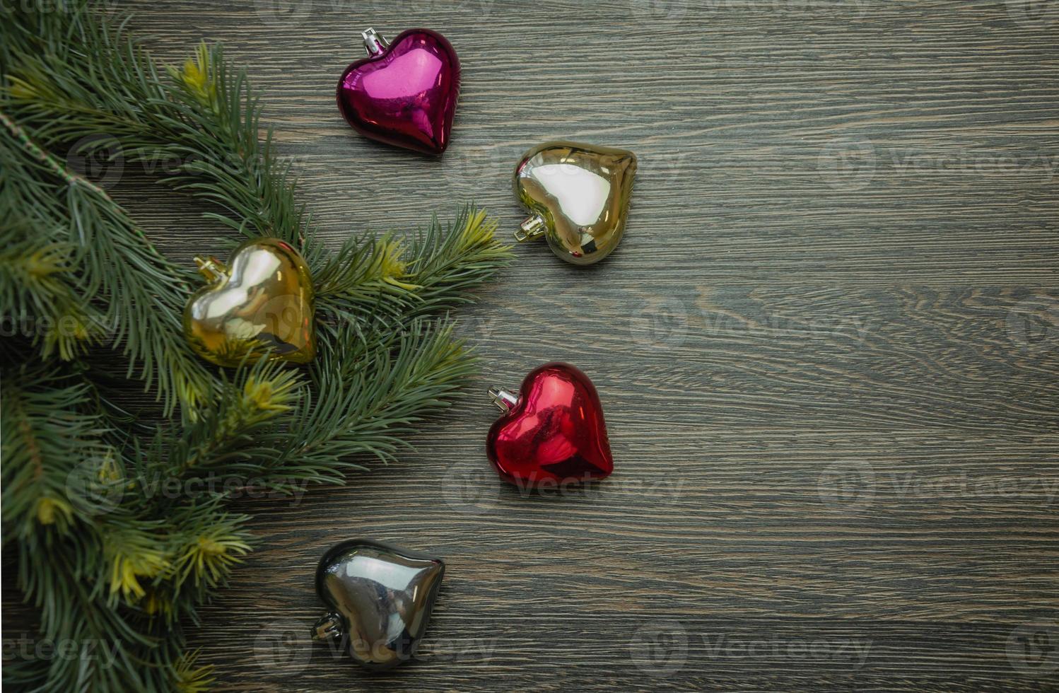 Christmas tree decorations in the form of hearts, Christmas tree toys heart of different colors photo