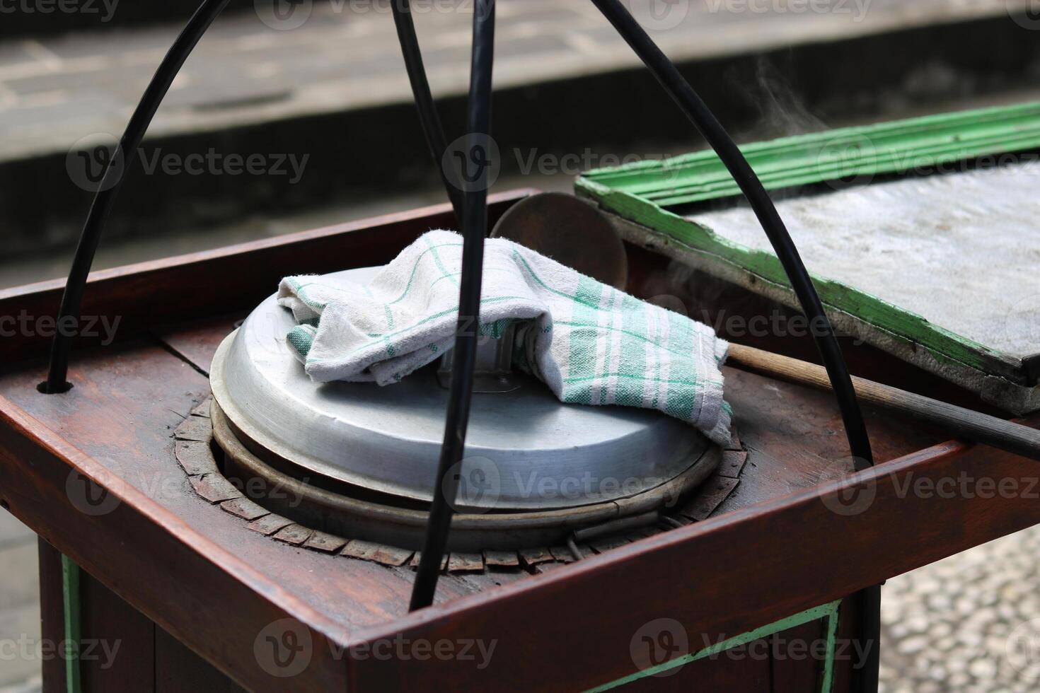 Wedang ronde Tangyuan, a traditional drink introduced by the Chinese and named by the Dutch, is usually sold using a carrying pole. photo