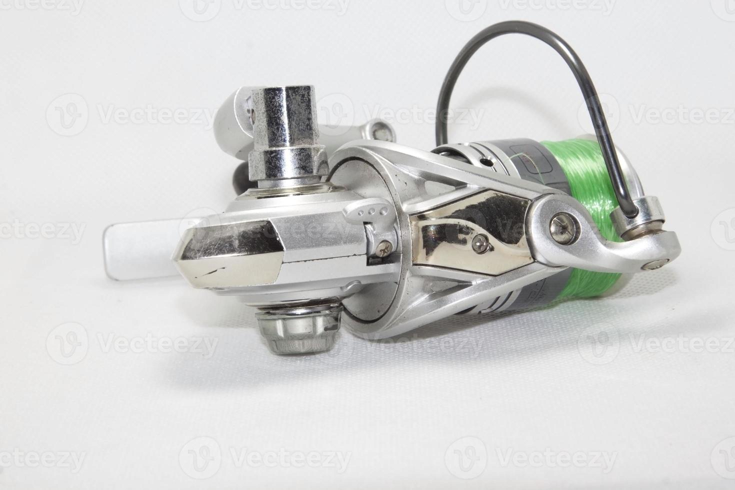 Fishing reel on a white background. Use lights and flash for sharpness in the studio. photo