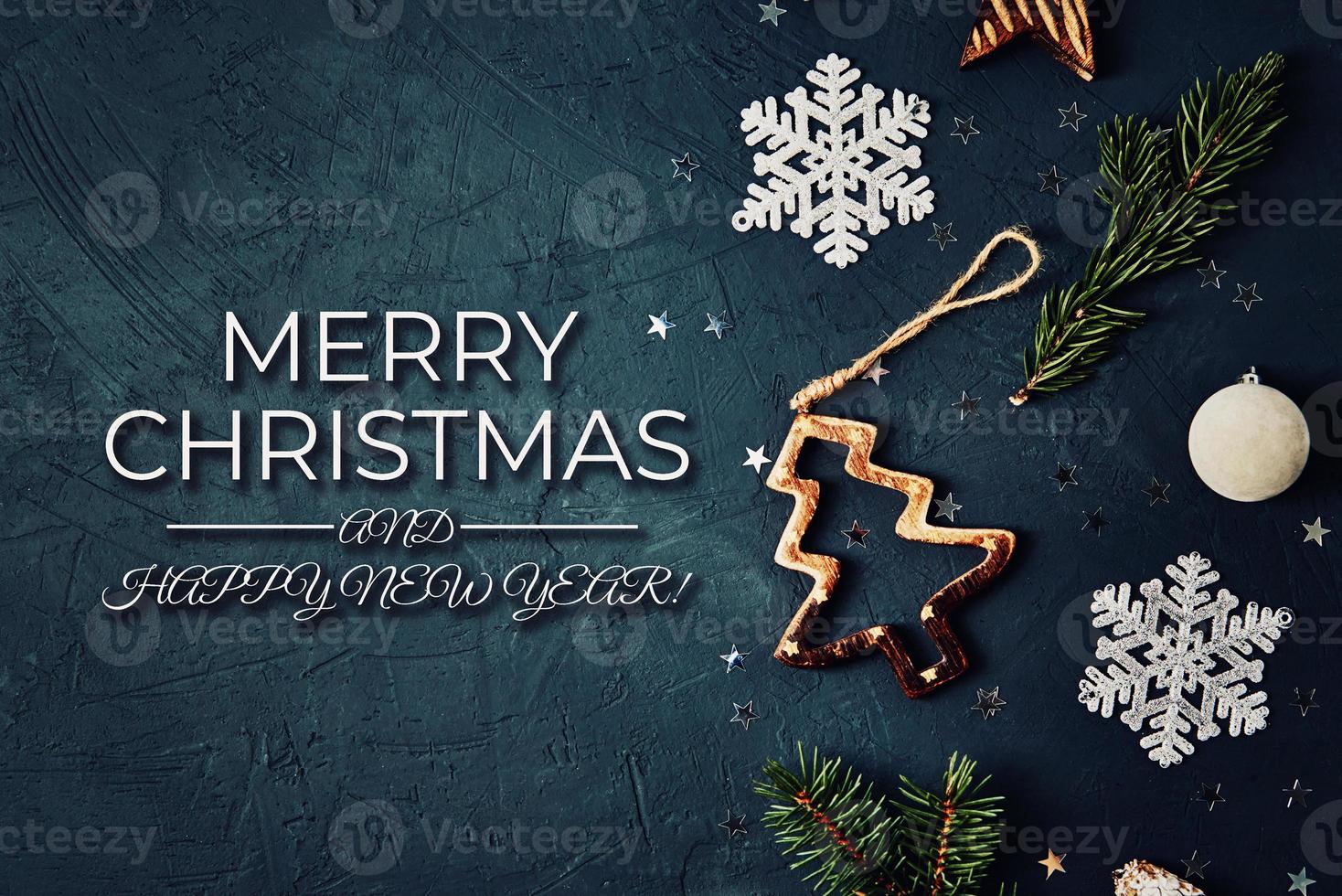 Christmas decorations on dark background, top view photo