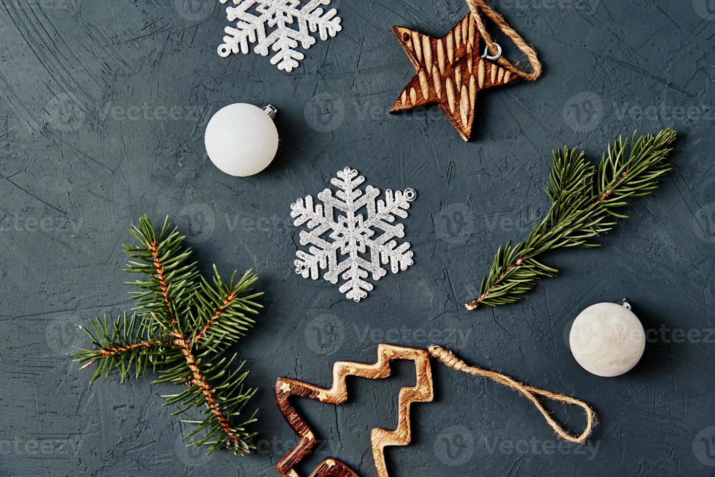 Christmas decorations on dark background, top view photo