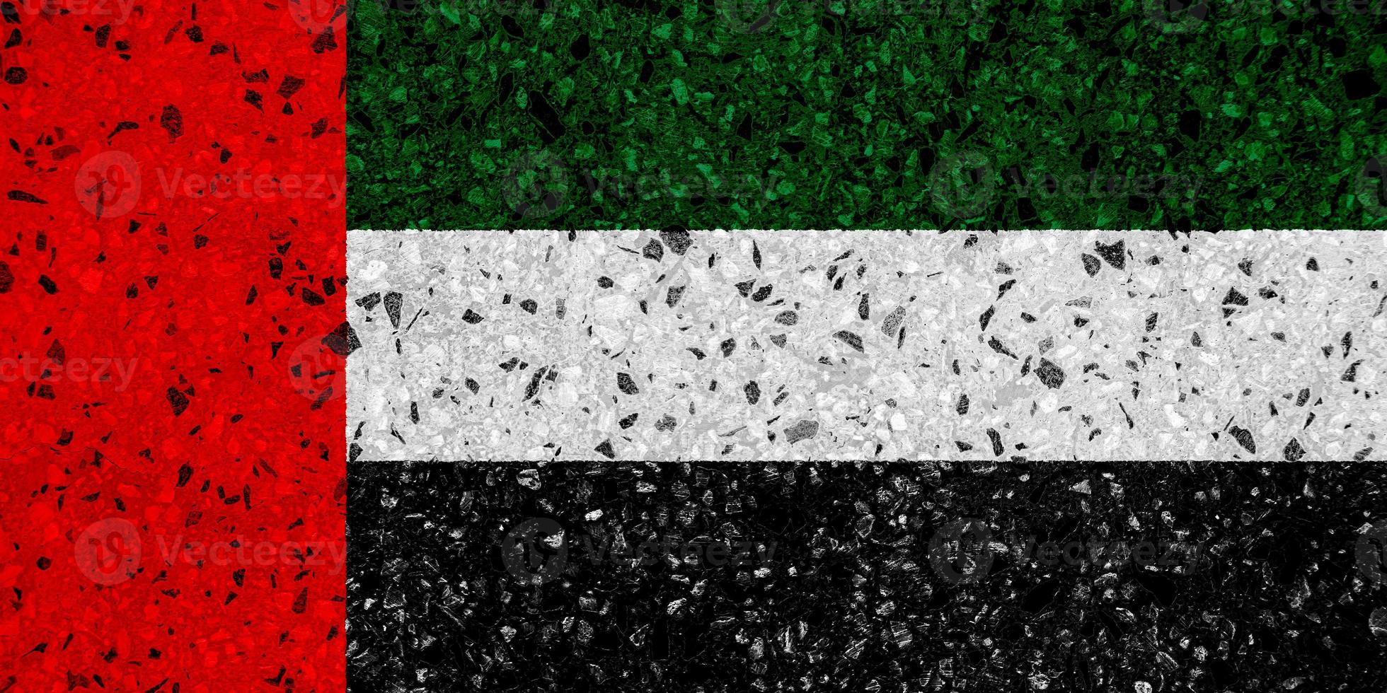 Flag of the United Arab Emirates on a textured background. Concept collage. photo