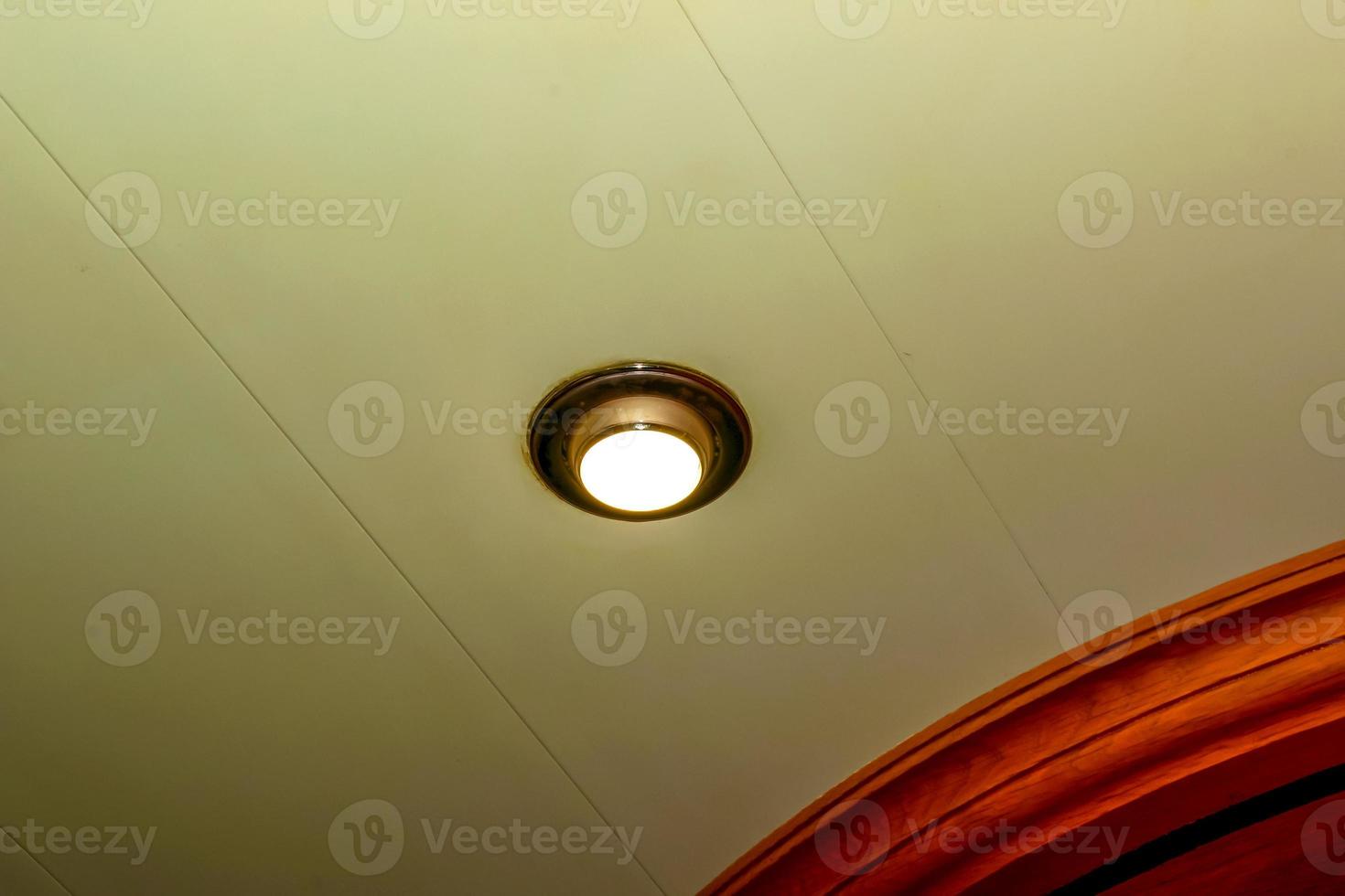 Ceiling lamp glows. Round surface of the lamp. Close-up photo. photo
