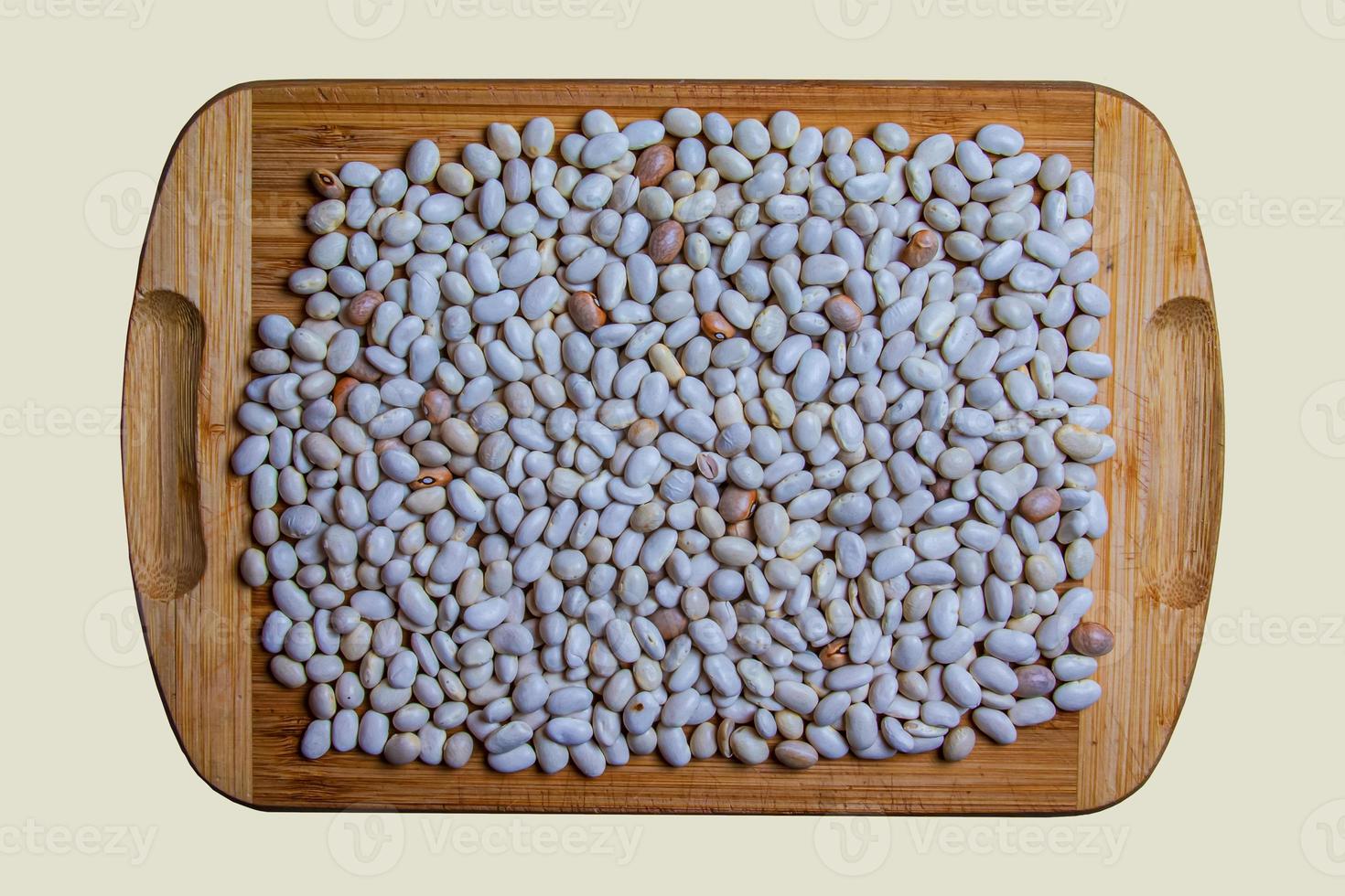 Background from white haricot bean beans. Texture from raw bean seeds. Healthy food concept. photo