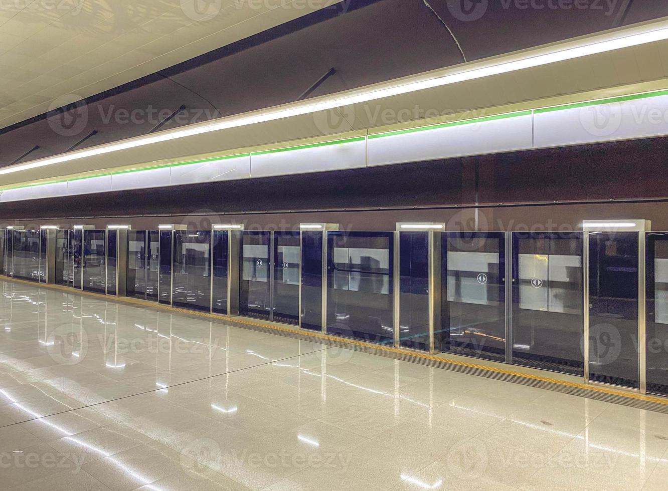 Platform sliding doors are a system used at subway stations that isolates passengers from railway tracks for the safety of passengers. The doors open after the train arrives at the station photo