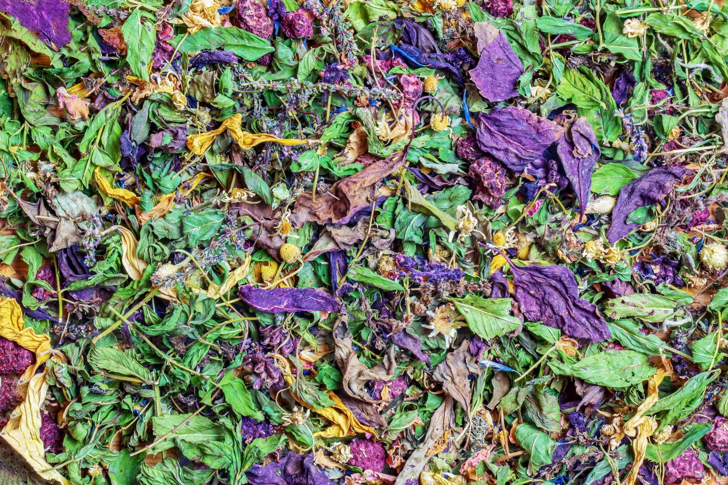 Dried herbal tea. Bright multi-colored background of tea from freshly dried medicinal herbs and flower petals. photo