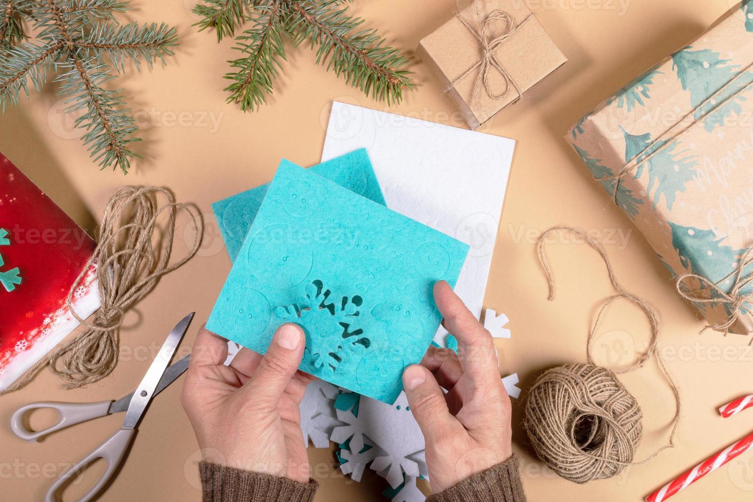 Step by step instruction of make DIY Xmas toy snowflake. Step 3 - Take out details of snowflakes from substrates. photo