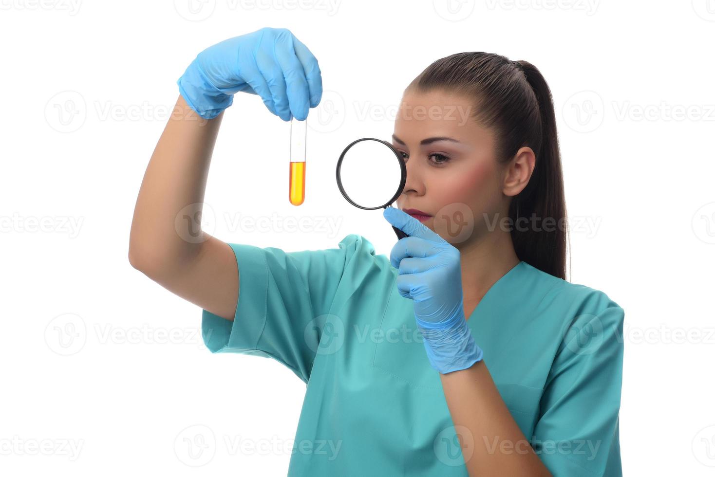 scientist working in the lab,  examines a test tube with liquid. medical concept. photo