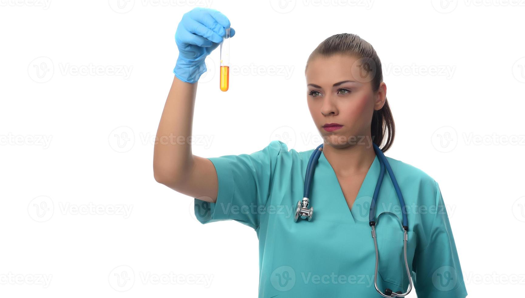 scientist working in the lab,  examines a test tube with liquid. medical concept. photo